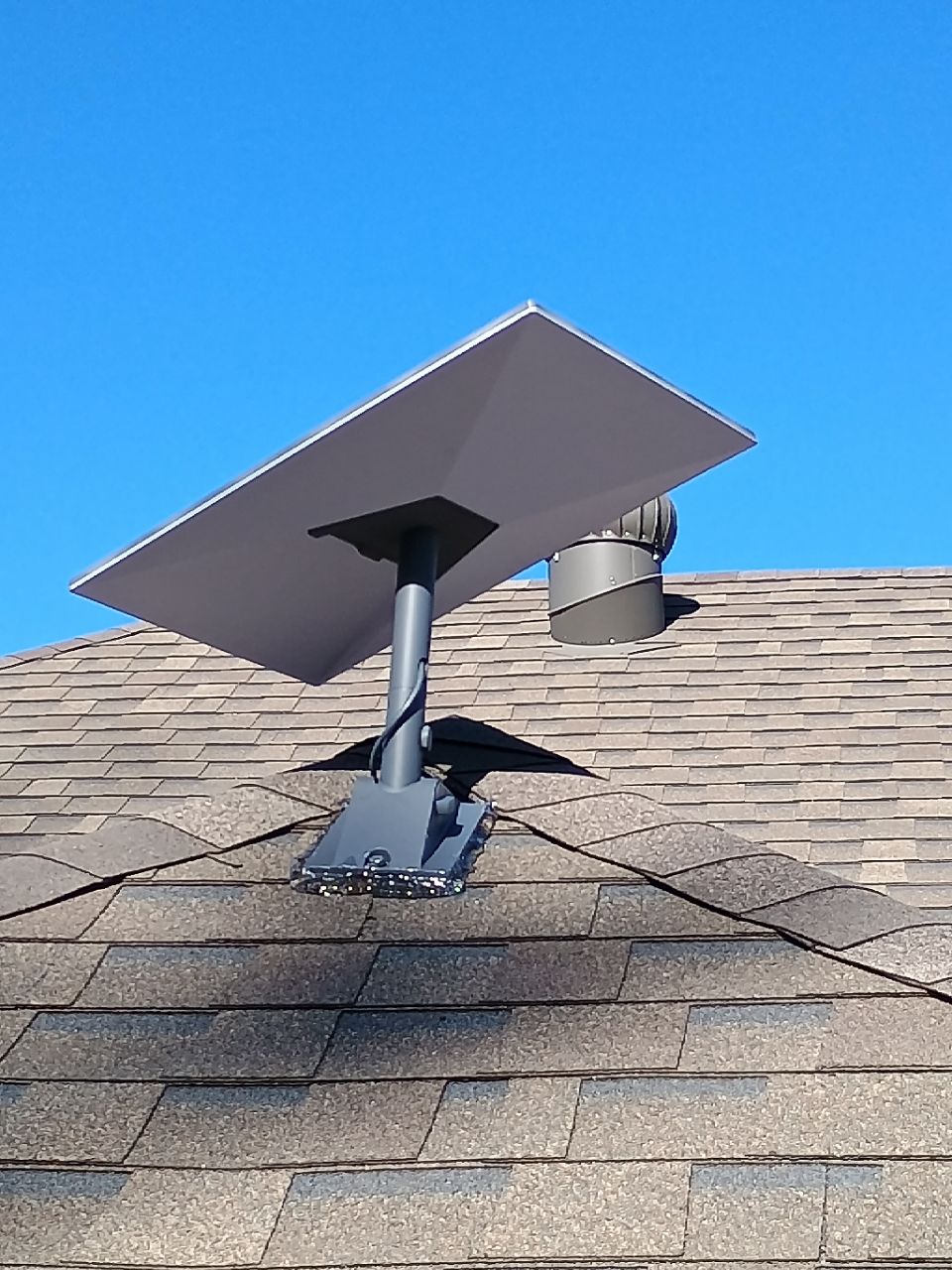 Starlink rooftop installation with pivot mount